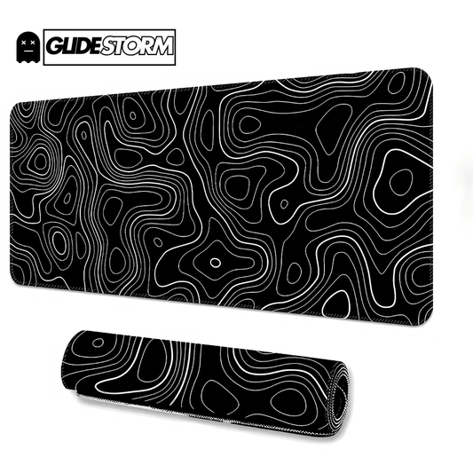 tapis de souris ergonomique noir avec motif topographique blanc et tapis roulé au premier plan