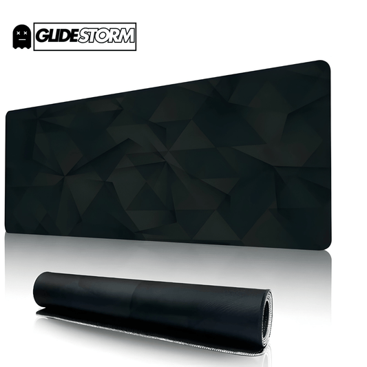 Tapis de souris ergonomique noir à motif géométrique foncé, format rectangulaire large avec un exemplaire enroulé au premier plan