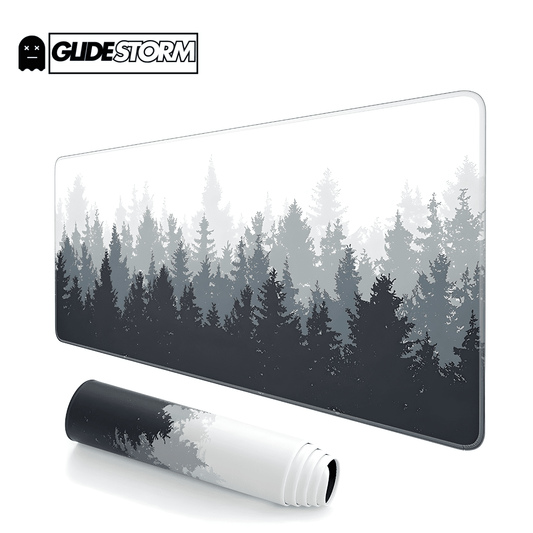 tapis de souris ergonomique avec motif de forêt de conifères en dégradé de gris sur fond blanc, version roulée en bas